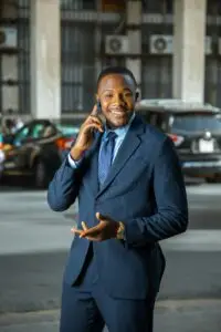 Confident South African business owner outside office building