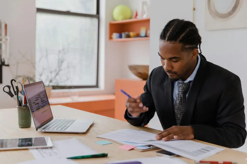 South African small business owner managing payroll software