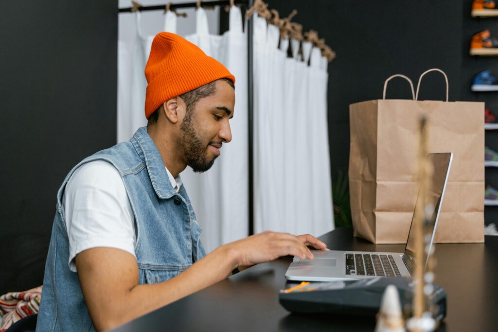 South African entrepreneur running successful online store from laptop