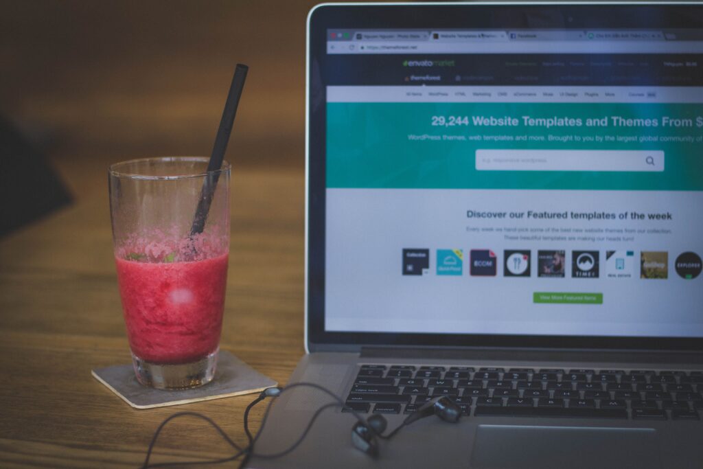 South African business owner creating professional website on laptop